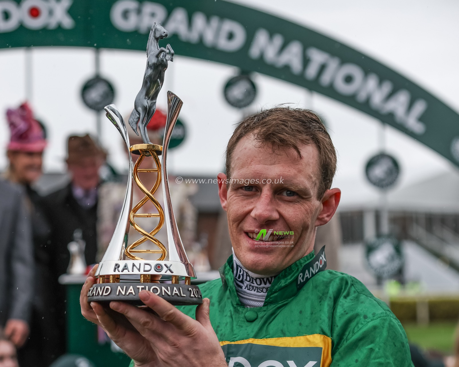 Paul Townend lifts the winner trophy as he wins the 16:00 Randox Grand National Handicap Chase on I Am Maximus during the Randox Grand National Day 2024 at Aintree Racecourse, Liverpool, United Kingdom, 13th April 2024

(Photo by Mark Cosgrove/News Images)