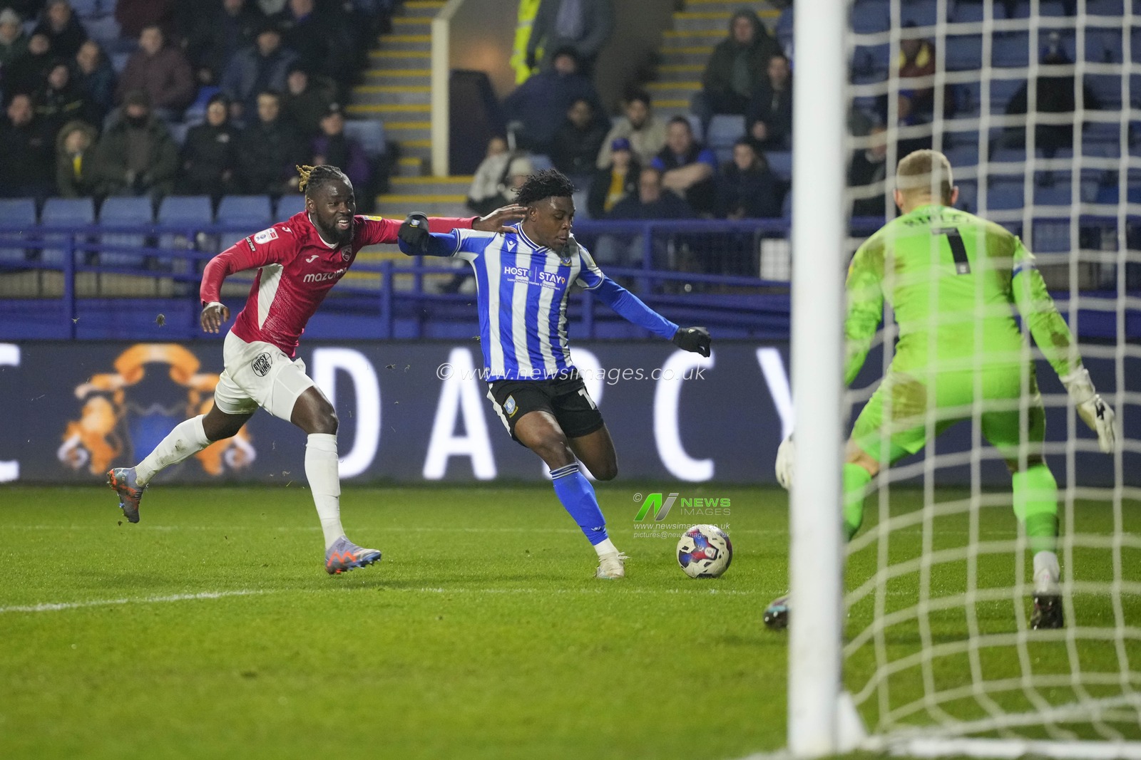 Fisayo Dele-Bashiru #17 of Sheffield Wednesday crosses the ball for his sides third goal during the Sky Bet League 1 match Sheffield Wednesday vs Morecambe at Hillsborough, Sheffield, United Kingdom, 14th February 2023

(Photo by Steve Flynn/News Images)