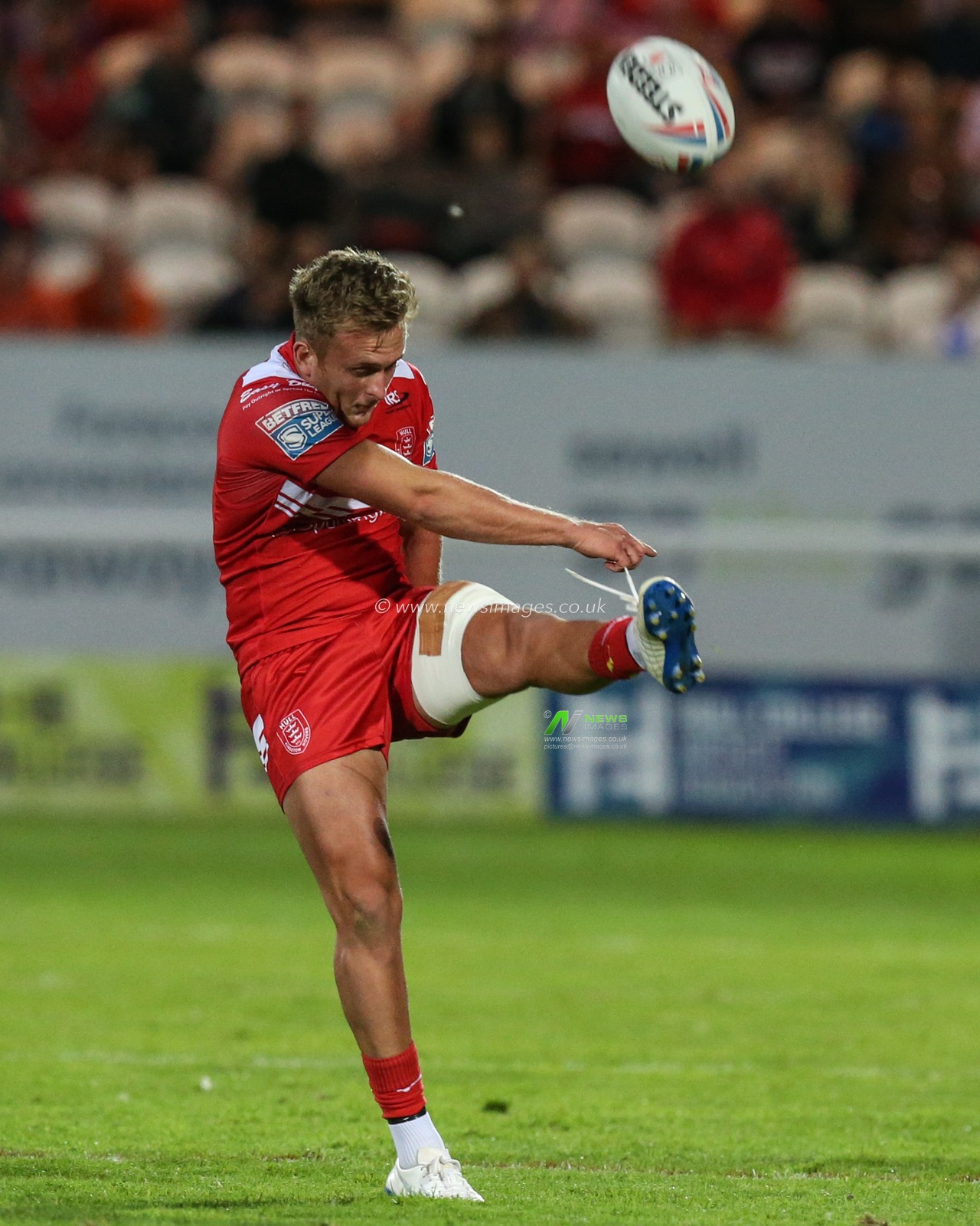 Jez Litten (14) of Hull KR puts up a high kick