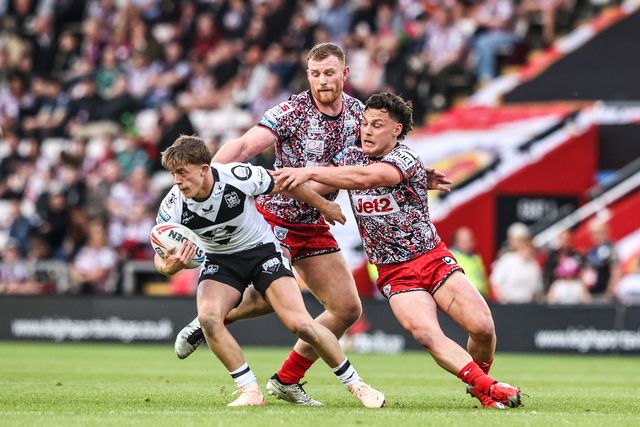 Logan Moy of Hull FC is tackled by Lachlan Lam of Leigh Leopards during the Betfred Super League round 12 match Leigh Leopards vs Hull FC at Leigh Sports Village, Leigh, United Kingdom on 22 May 2026

(Photo by Alfie Cosgrove/News Images)