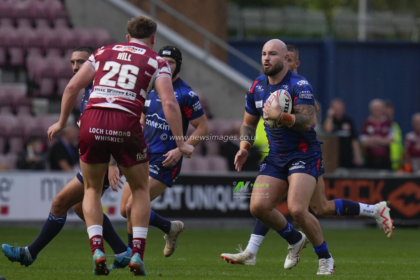 Sam Luckley #26 of Hull KR runs at the Wigan Warriors defence during the Betfred Super League Semi Final match Wigan Warriors vs Hull KR at DW Stadium, Wigan, United Kingdom, 7th October 2023

(Photo by Steve Flynn/News Images)