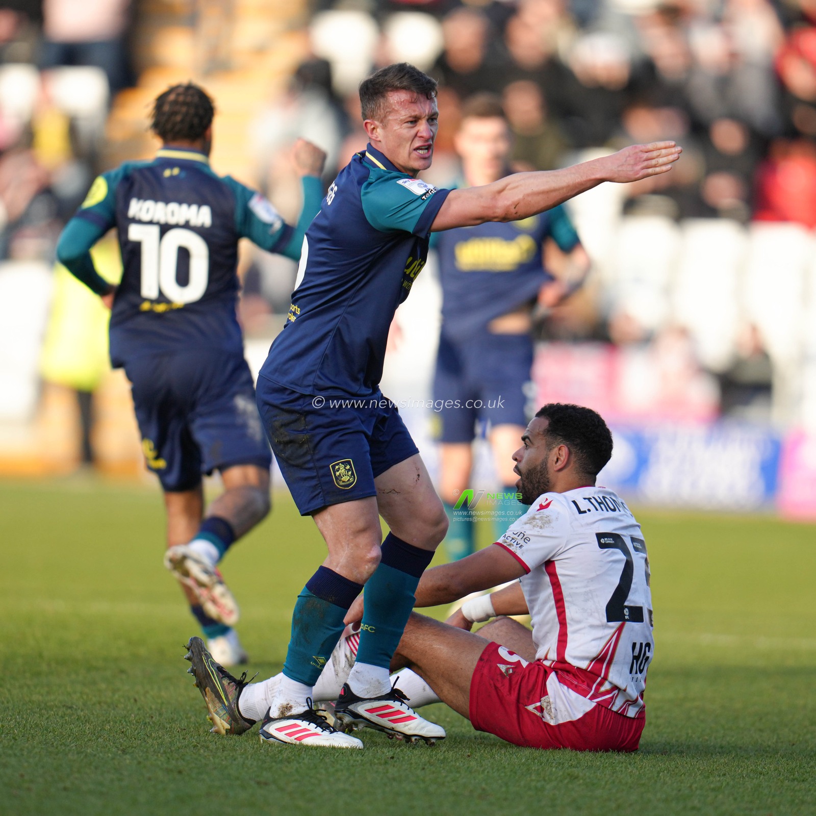 Jonathan Hogg of Huddersfield Town shouts instructions after foul at players during the Sky Bet League 1 match Stevenage vs Huddersfield Town at Lamex Stadium, Stevenage, United Kingdom, 1st March 2025

(Photo by Harvey Murphy/News Images)