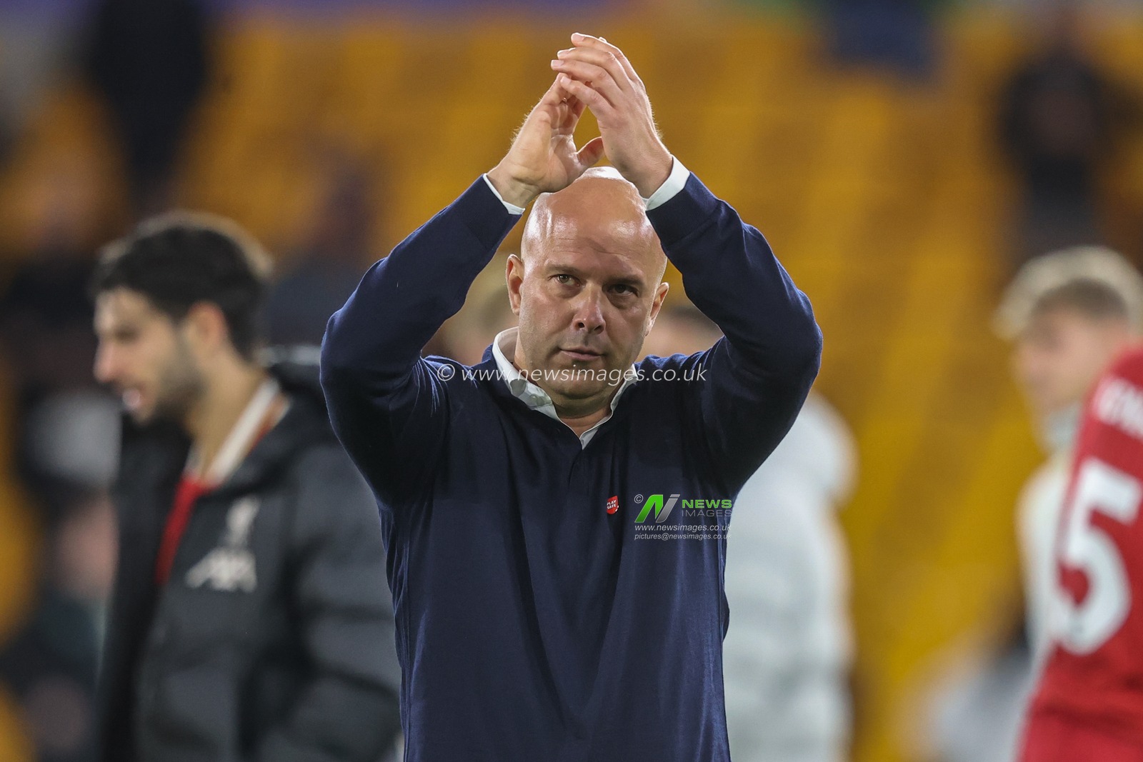 Arne Slot manager of Liverpool applauds the travelling fans after the game during the Premier League match Wolverhampton Wanderers vs Liverpool at Molineux, Wolverhampton, United Kingdom, 28th September 2024

(Photo by Alfie Cosgrove/News Images)