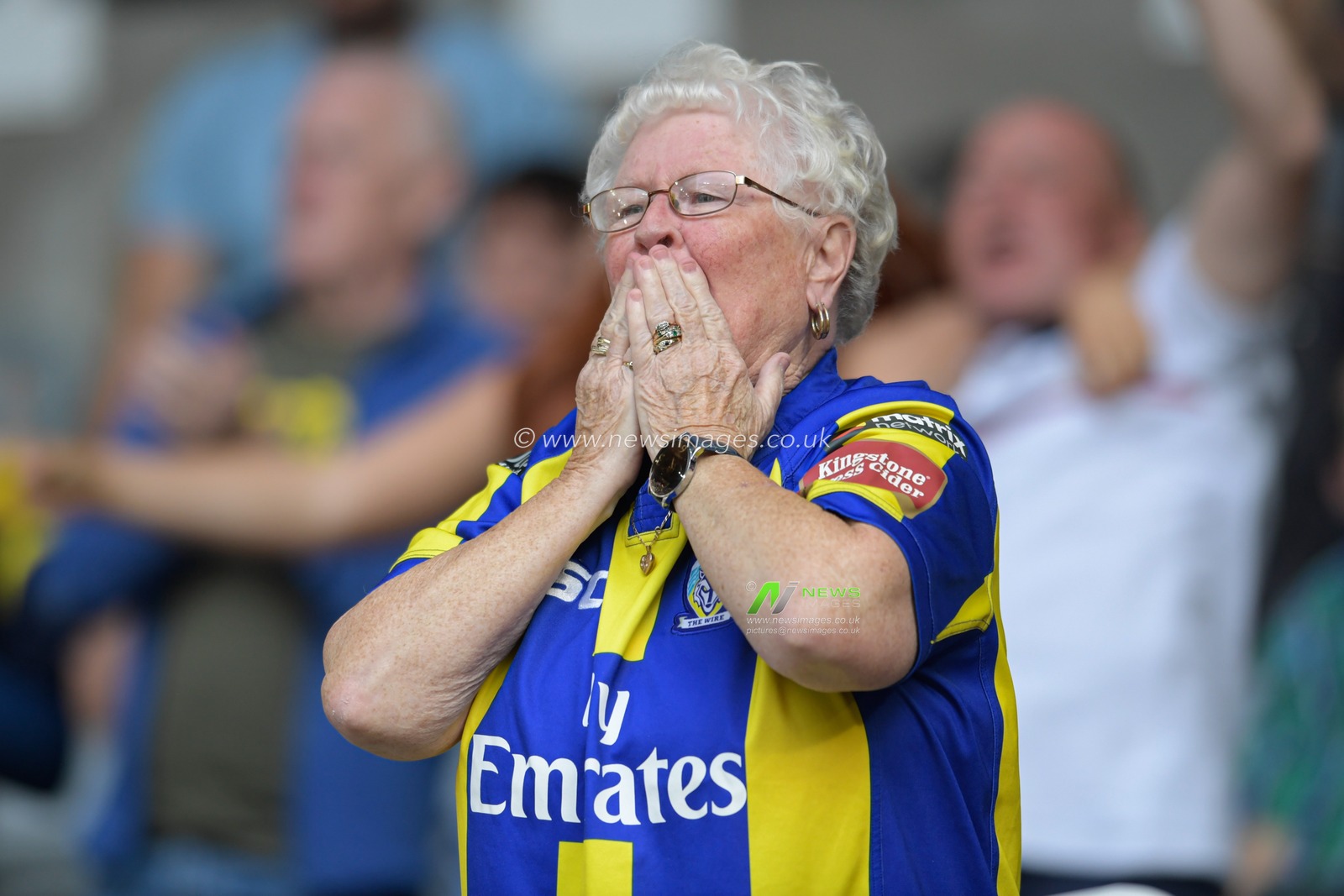 A Warrington Wolves fan blows kisses to the team after they beat Wigan Warriors 6-10