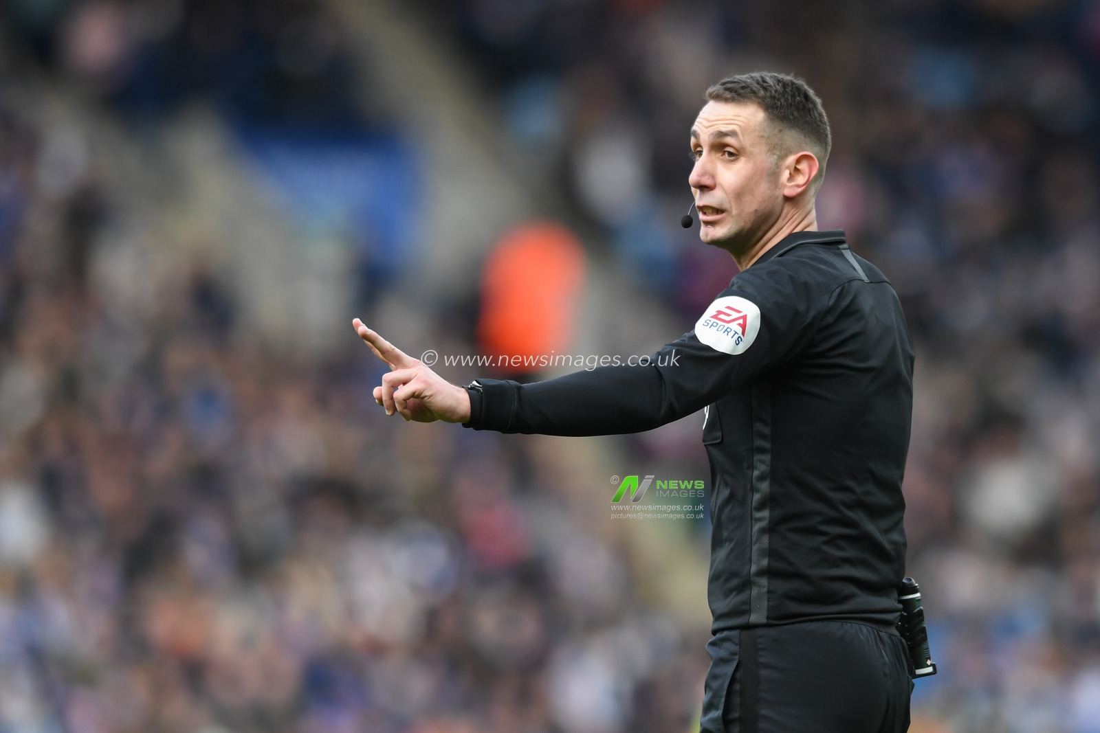 Referee David Coote makes a decision