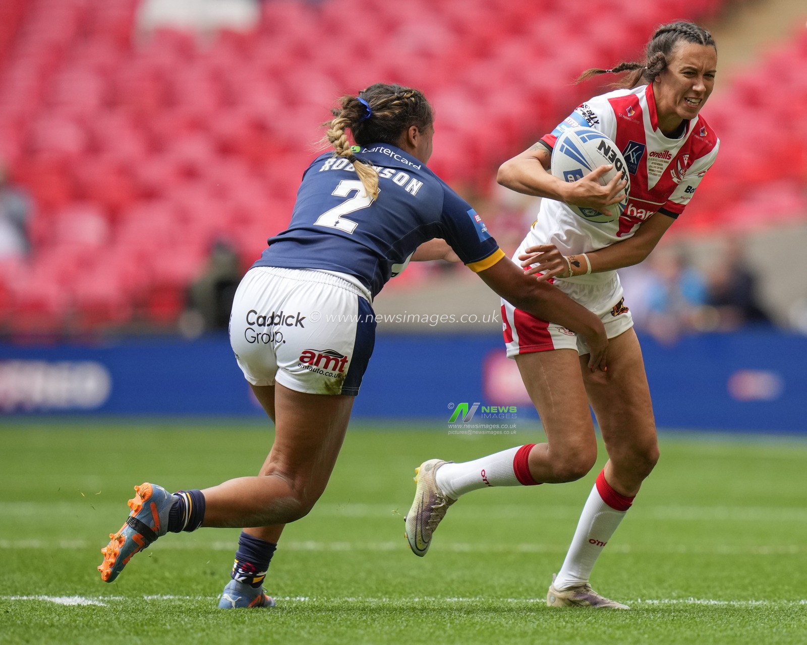 Zoe Harris #6 of St. Helens breaks past Sophie Robinson #2 of Leeds Rhinos during the Betfred Womens Challenge Cup Final match Leeds Rhinos vs St Helens at Wembley Stadium, London, United Kingdom, 12th August 2023

(Photo by Steve Flynn/News Images)