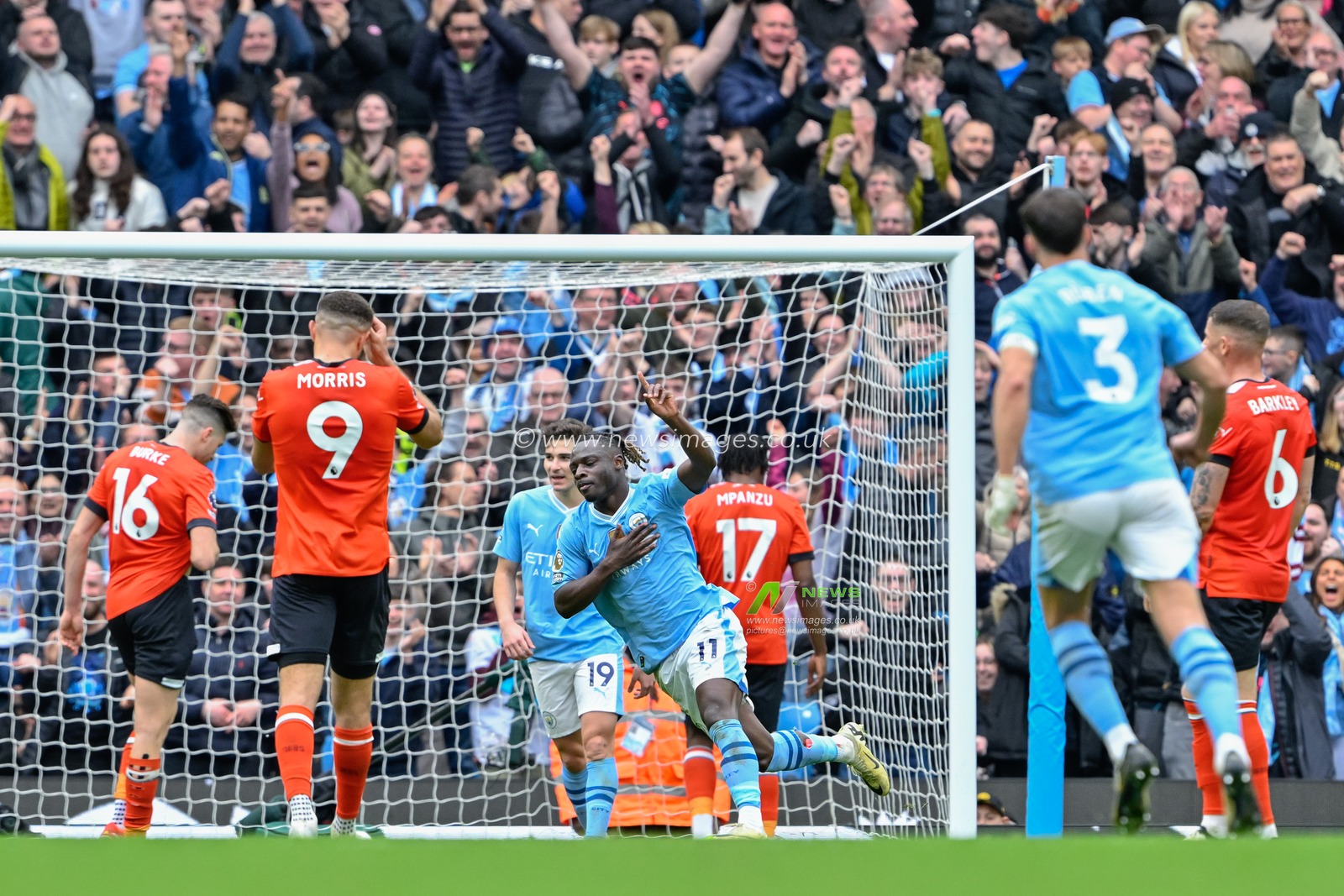 JÃ©rÃ©my Doku of Manchester City celebrates his goal to make it 4-1 Manchester City, during the Premier League match Manchester City vs Luton Town at Etihad Stadium, Manchester, United Kingdom, 13th April 2024

(Photo by Cody Froggatt/News Images)