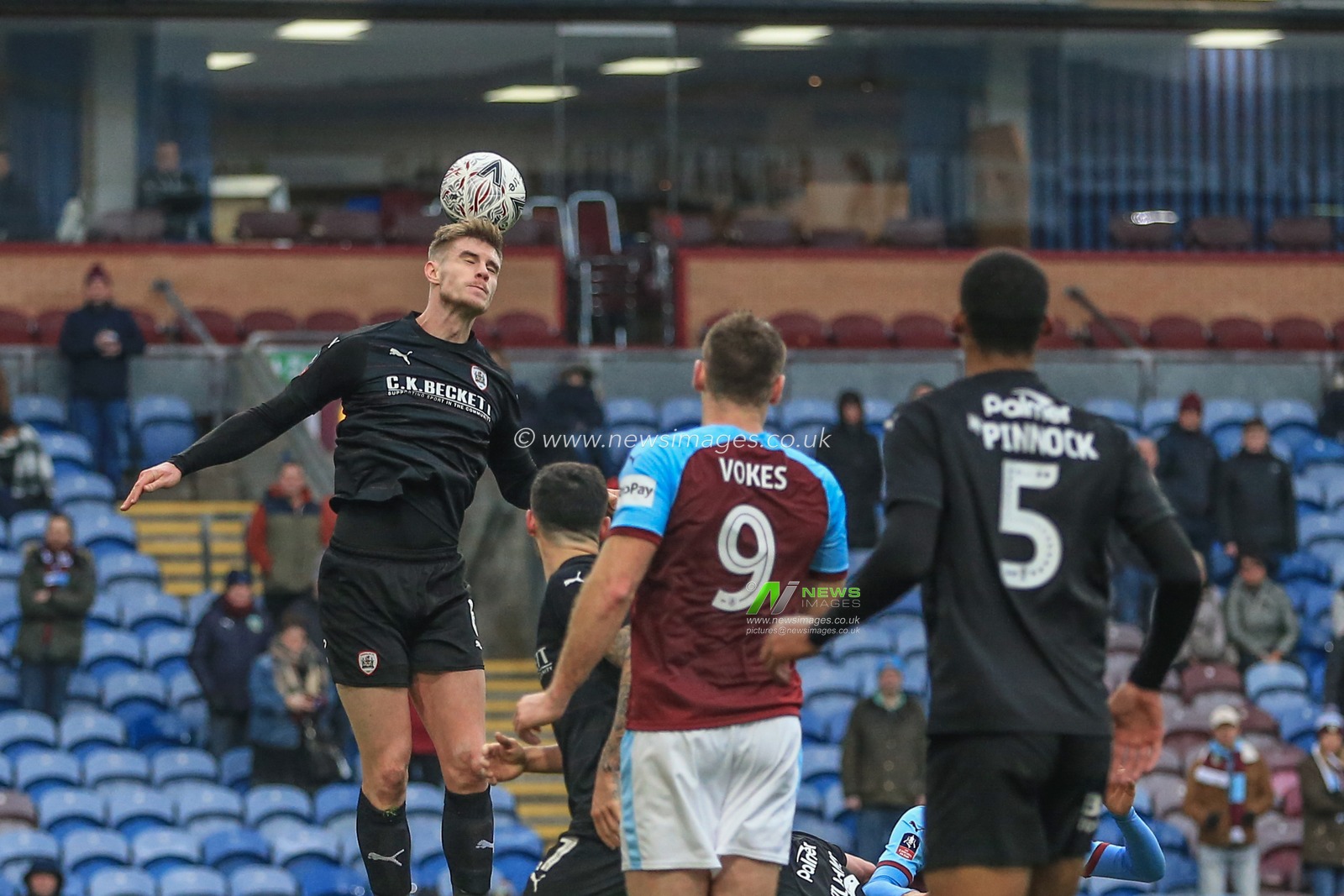 5th January 2019, Turf Moor, Burnley, England ; The Emirates FA Cup, 3rd Round, Burnley vs Barnsley : Liam Lindsay (06) of Barnsley heads the ball clear from a corner 

Credit: Mark Cosgrove/News Images

English Football League images are subject to DataCo Licence