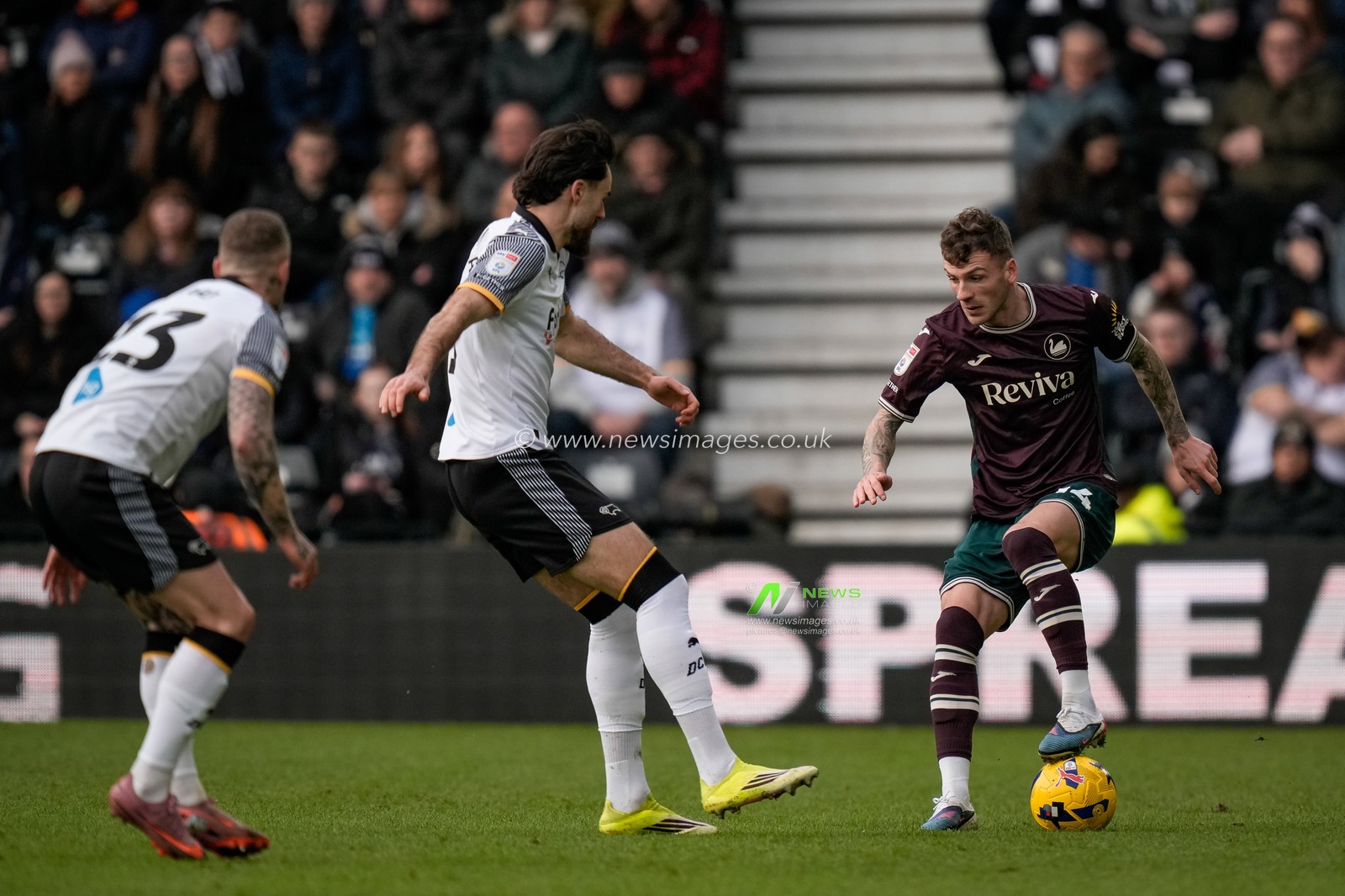 Josh Tymon of Swansea City makes a run with the ball while marked by Ben Brereton Diaz of Derby County  during the Sky Bet Championship match Derby County vs Swansea City at Pride Park Stadium, Derby, United Kingdom on 14 February 2026

(Photo by Maynard Manyowa/News Images)