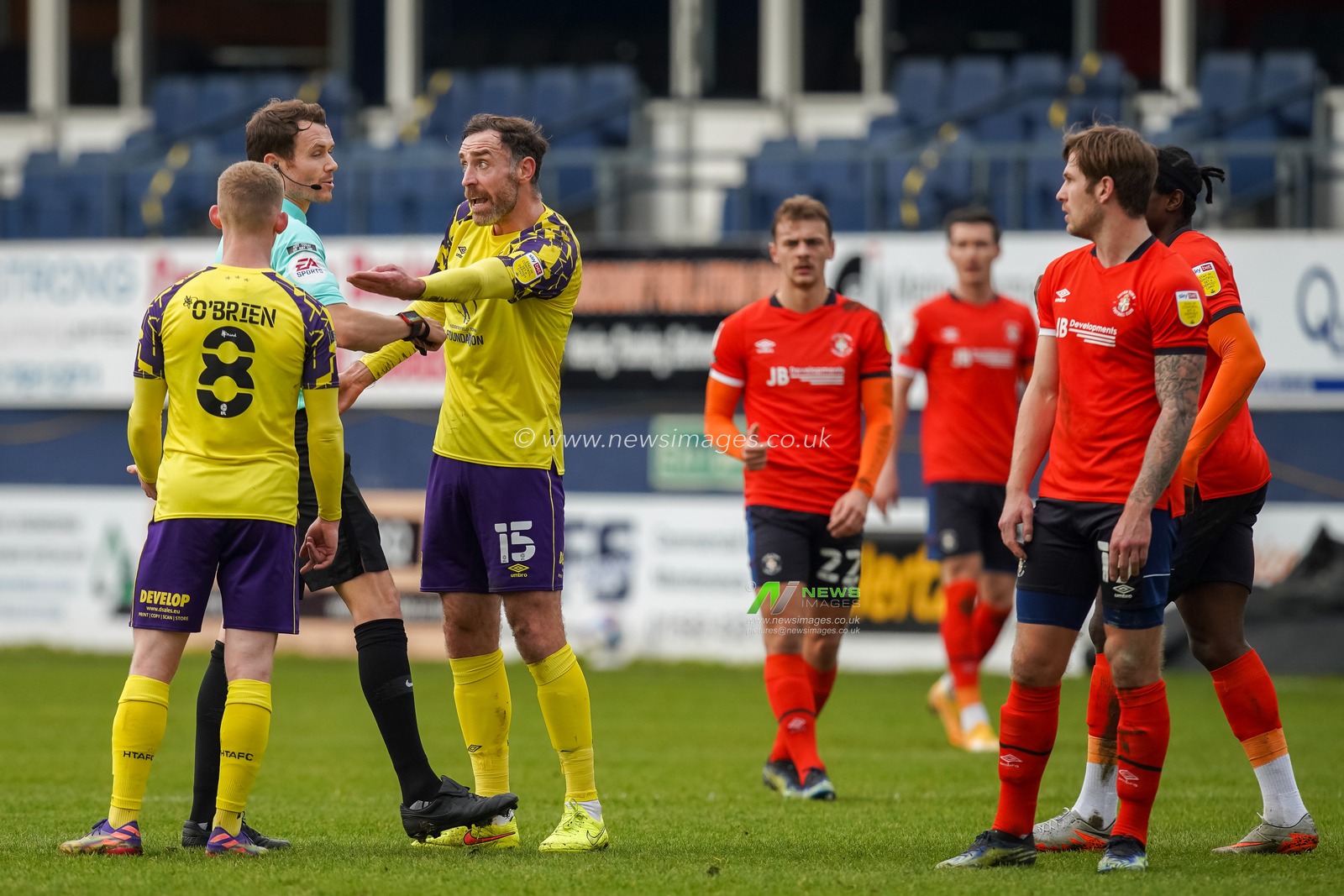 Richard Keogh #15 of Huddersfield Town makes a point to the referee Leigh Doughty
