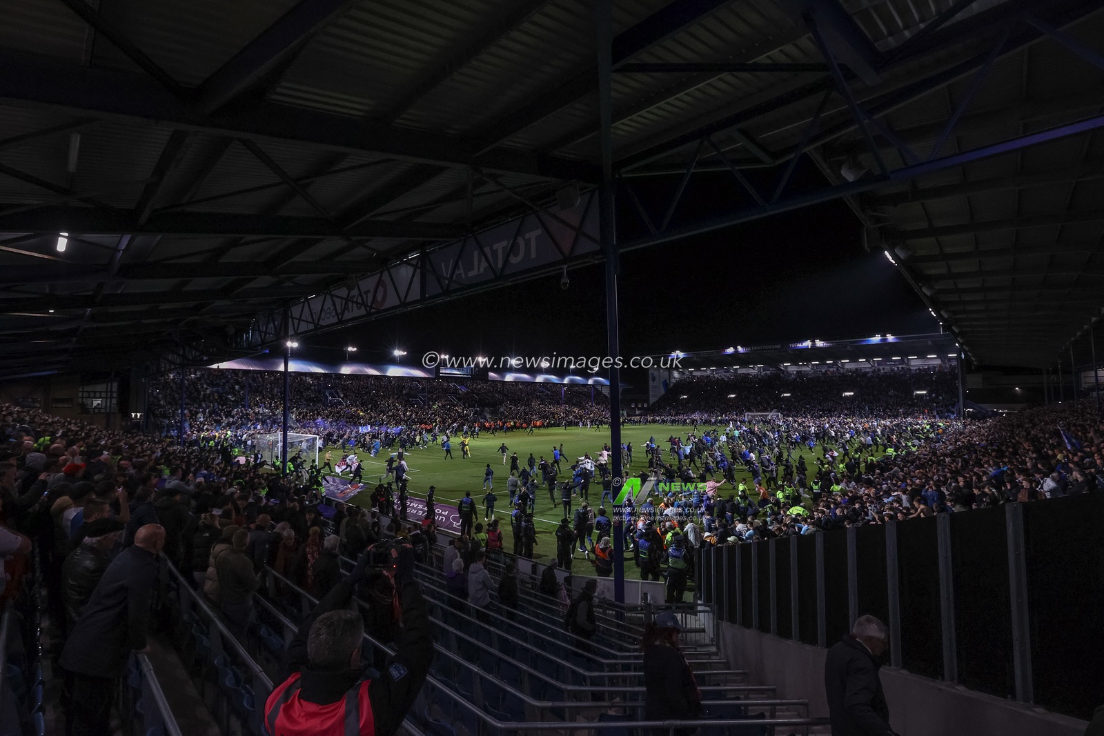 Portsmouth fans invaded the pitch after winning 3-2 and winning League One during the Sky Bet League 1 match Portsmouth vs Barnsley at Fratton Park, Portsmouth, United Kingdom, 16th April 2024

(Photo by Mark Cosgrove/News Images)