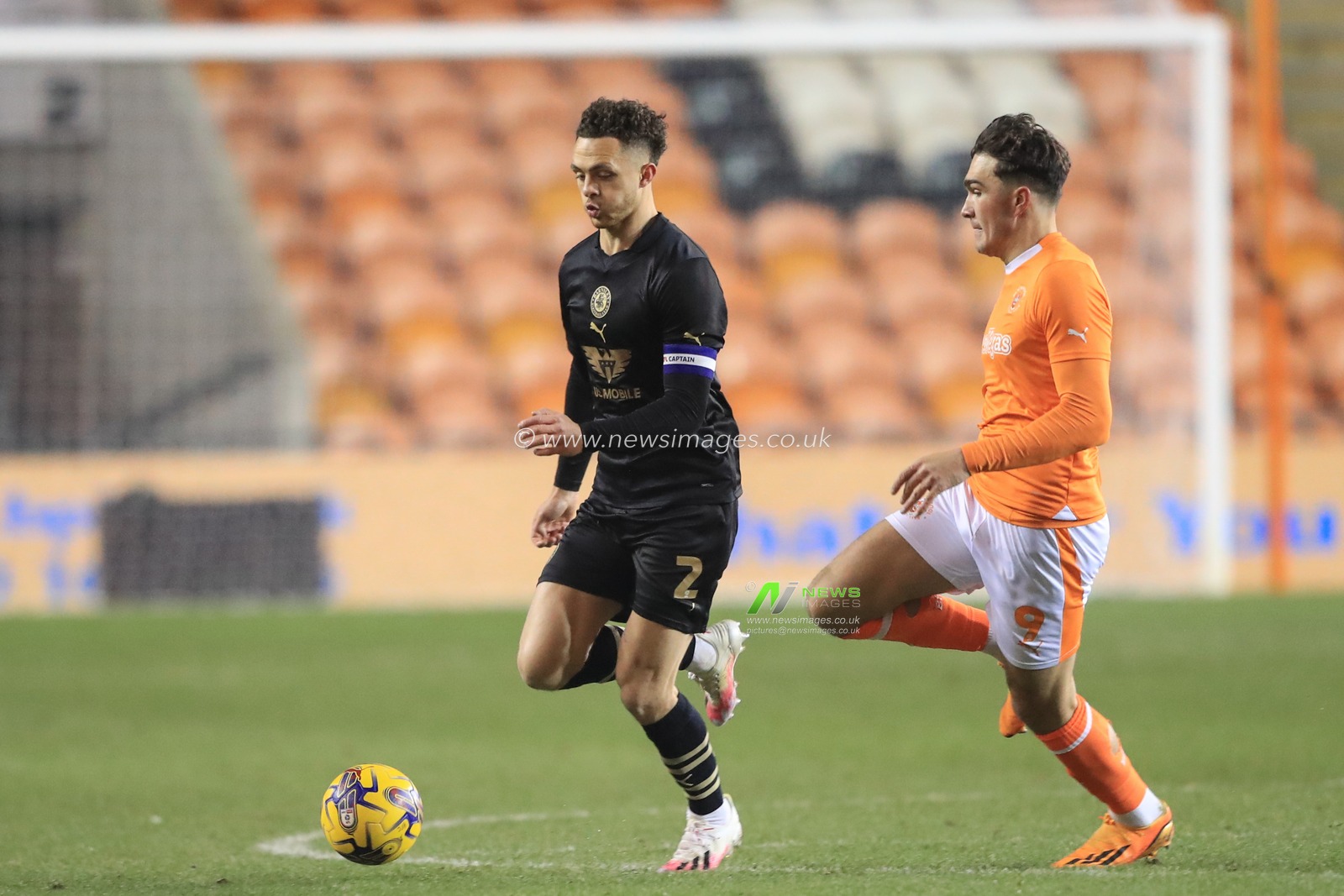 Jordan Williams #2 of Barnsley breaks with the ball as Kyle Joseph #9 of Blackpool follows during the Bristol Street Motors Trophy match Blackpool vs Barnsley at Bloomfield Road, Blackpool, United Kingdom, 5th December 2023

(Photo by Alfie Cosgrove/News Images)