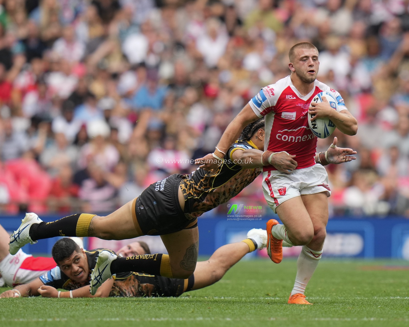 Mikey Lewis #20 of Hull KR breaks the tackle from Tom Amone #8 of Leigh Leopards during the Betfred Challenge Cup match Hull KR vs Leigh Leopards at Wembley Stadium, London, United Kingdom, 12th August 2023

(Photo by Steve Flynn/News Images)