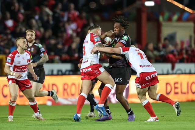 Junior Nsemba of Wigan Warriors is tackled by Elliot Minchella of Hull KR during the Betfred Super League Round 9 match Hull KR vs Wigan Warriors at Sewell Group Craven Park, Kingston upon Hull, United Kingdom, 26th April 2024

(Photo by Mark Cosgrove/News Images)