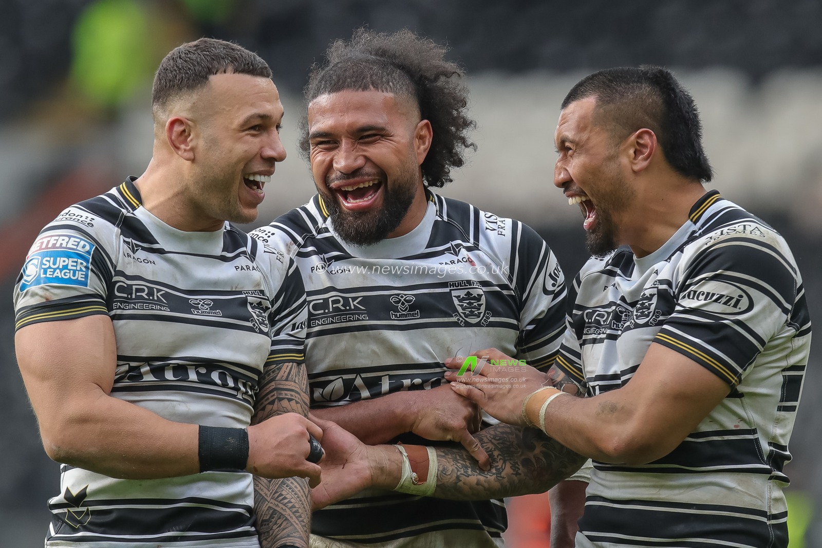 Chris Satae #10, Ligi Sao #8 and Carlos Tuimavave #3 of Hull FC celebrate the win at full time after the Betfred Super League Round 10 match Hull FC vs Huddersfield Giants at MKM Stadium, Hull, United Kingdom, 23rd April 2023

(Photo by James Heaton/News Images)