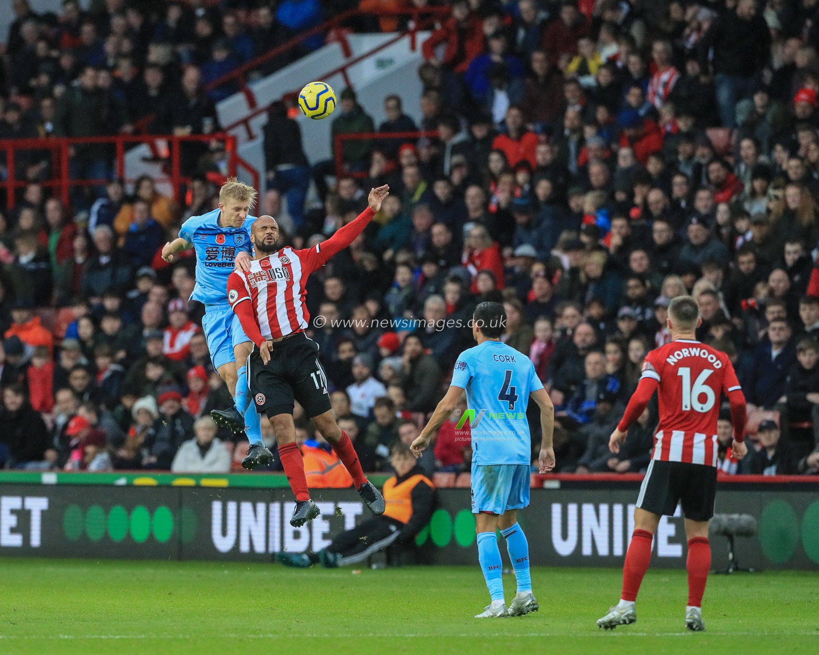2nd November 2019, Bramall Lane, Sheffield, England; Premier League, Sheffield United v Burnley : Ben Mee (6) of Burnley wins the highball challenge with David McGoldrick (17) of Sheffield United 

Credit: Mark Cosgrove/News Images