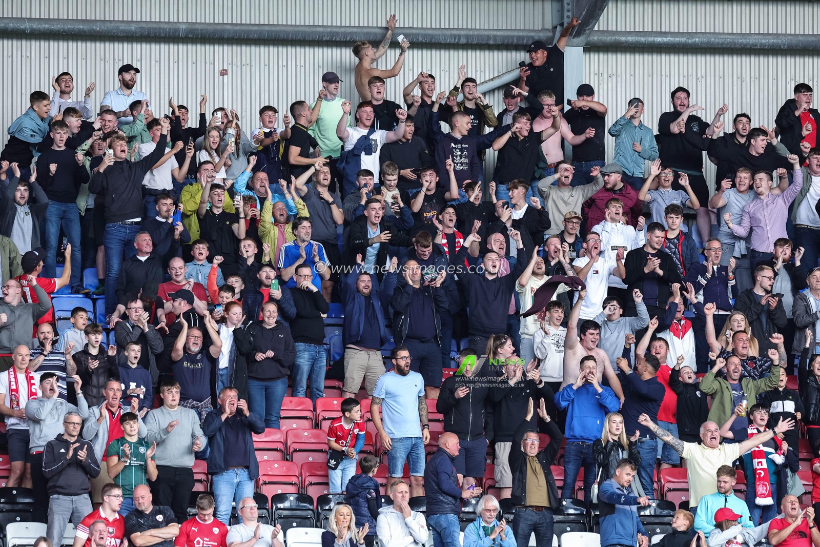 Barnsley fans celebrate the 0-2 win during the Sky Bet League 1 match Wigan Athletic vs Barnsley at DW Stadium, Wigan, United Kingdom, 26th August 2023

(Photo by Mark Cosgrove/News Images)