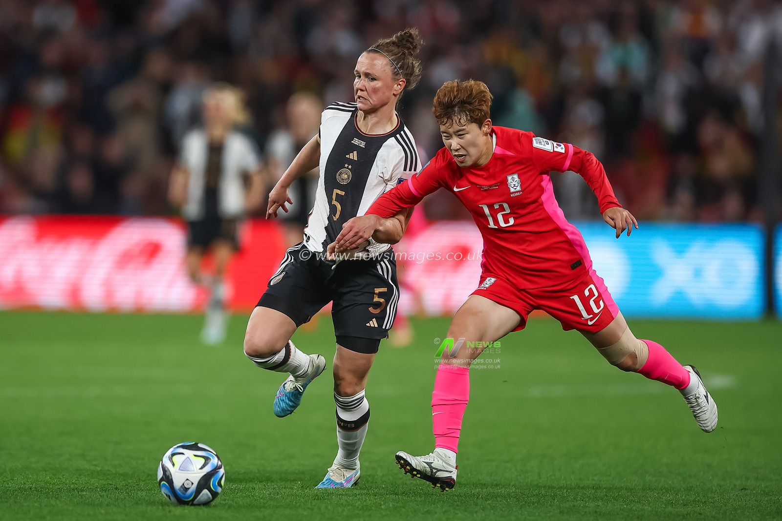Moon Mi-ra #12 of South Korea and Marina Hegering #5 of Germany  battle for the ball during the FIFA Women's World Cup 2023 Group H match South Korea vs Germany Women at Suncorp Stadium, Brisbane, Australia, 3rd August 2023

(Photo by Patrick Hoelscher/News Images)