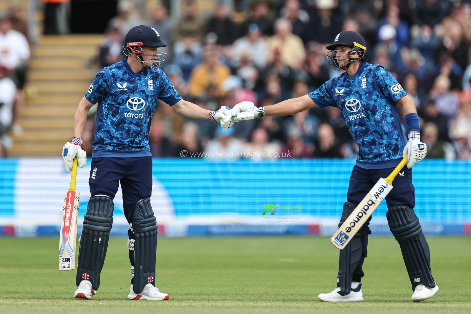 Joe Root of England fist-bumps England captain Harry Brook after he hits a peach of a six during the 2nd Metro Bank ODI England v West Indies at Sophia Gardens Cricket Ground, Cardiff, United Kingdom, 1st June 2025

(Photo by Mark Cosgrove/News Images)