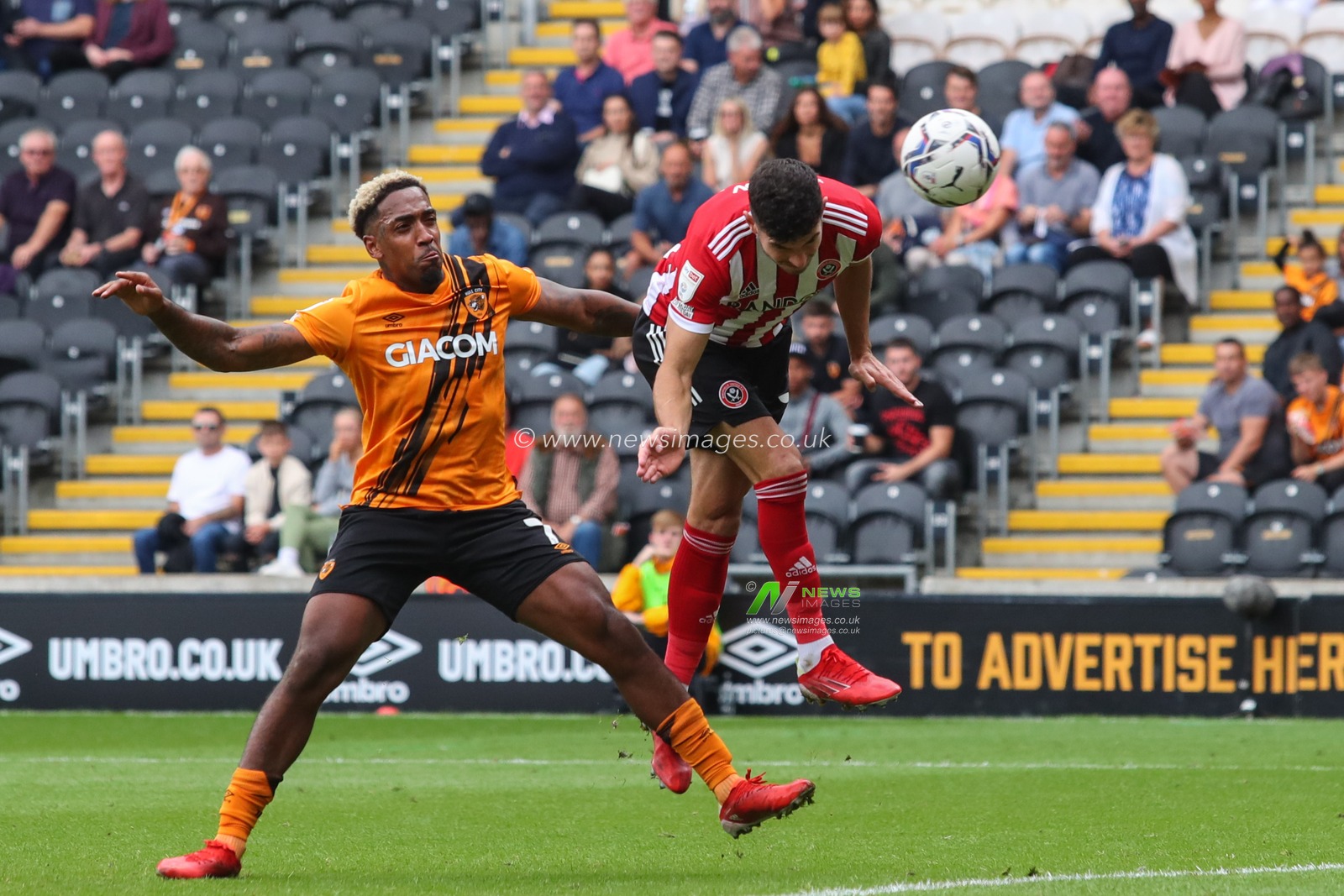 John Egan #12 of Sheffield United heads the ball to score and make the score 0-2