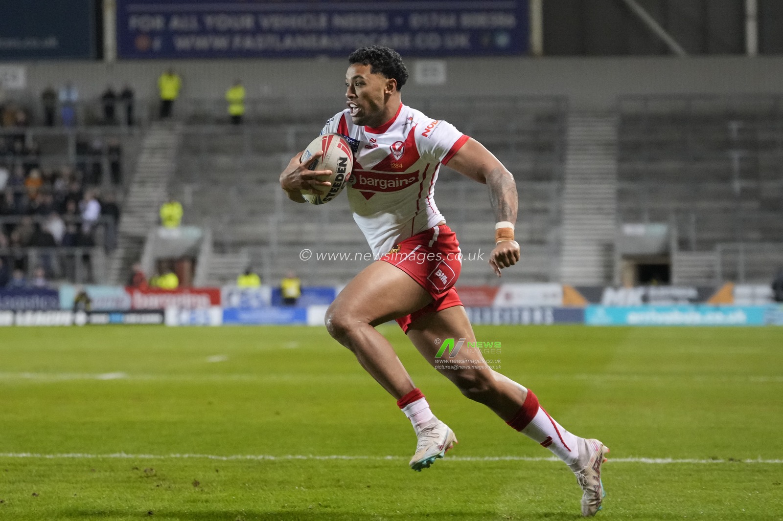 Waqa Blake of St. Helens runs to with the ball during the Betfred Super League  Round 8 match St Helens vs Hull FC at Totally Wicked Stadium, St Helens, United Kingdom, 19th April 2024

(Photo by Steve Flynn/News Images)