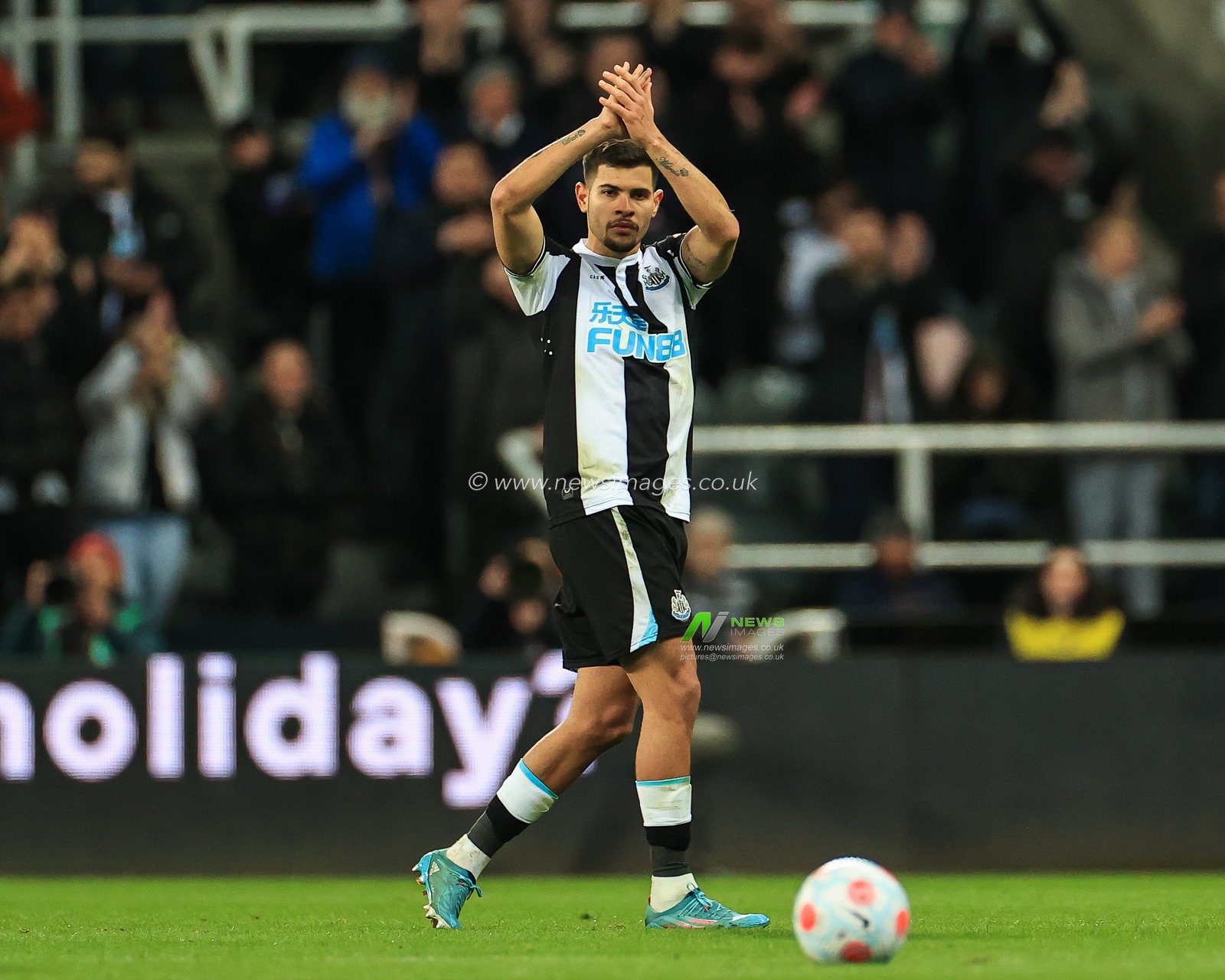 Bruno Guimaraes #39 of Newcastle United applauds the fans as he is substituted