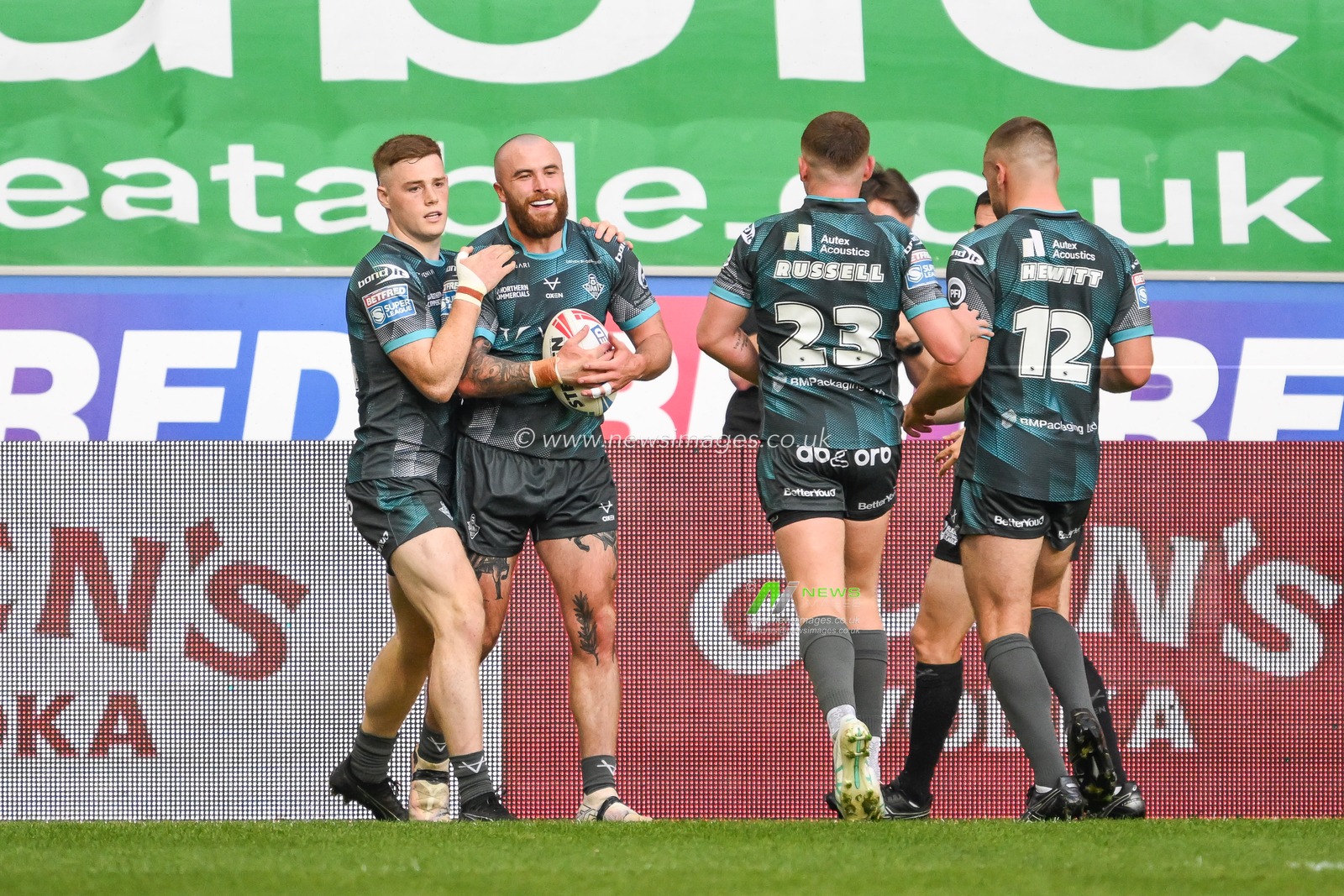 Jake Bibby of Huddersfield Giants celebrates his try during the Betfred Super League Round 20 match Wigan Warriors vs Huddersfield Giants at DW Stadium, Wigan, United Kingdom, 1st August 2024

(Photo by Craig Thomas/News Images)