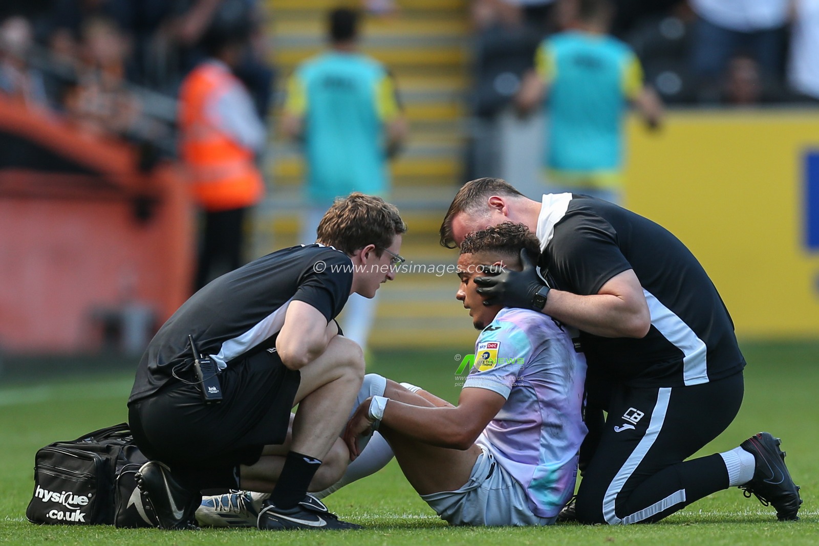 Max Aarons #2 of Norwich City receives medical attention in the first half