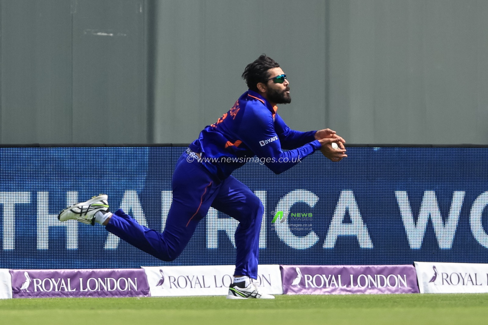 Ravindra Jadeja of India catches Jos Buttler of England, out
