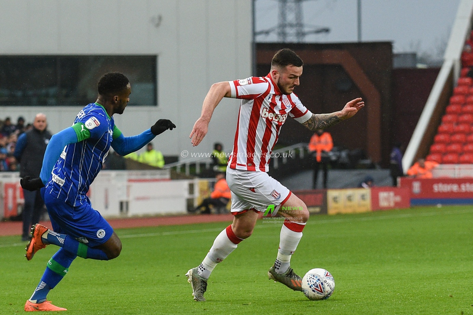23rd November 2019, Bet365 Stadium, Stoke-on-Trent, England; Sky Bet Championship, Stoke City v Wigan Athletic : Tom Edwards (2) of Stoke City is tracked by Cheyenne Dunkley (22) of Wigan Athletic 

Credit: Richard Long/News Images