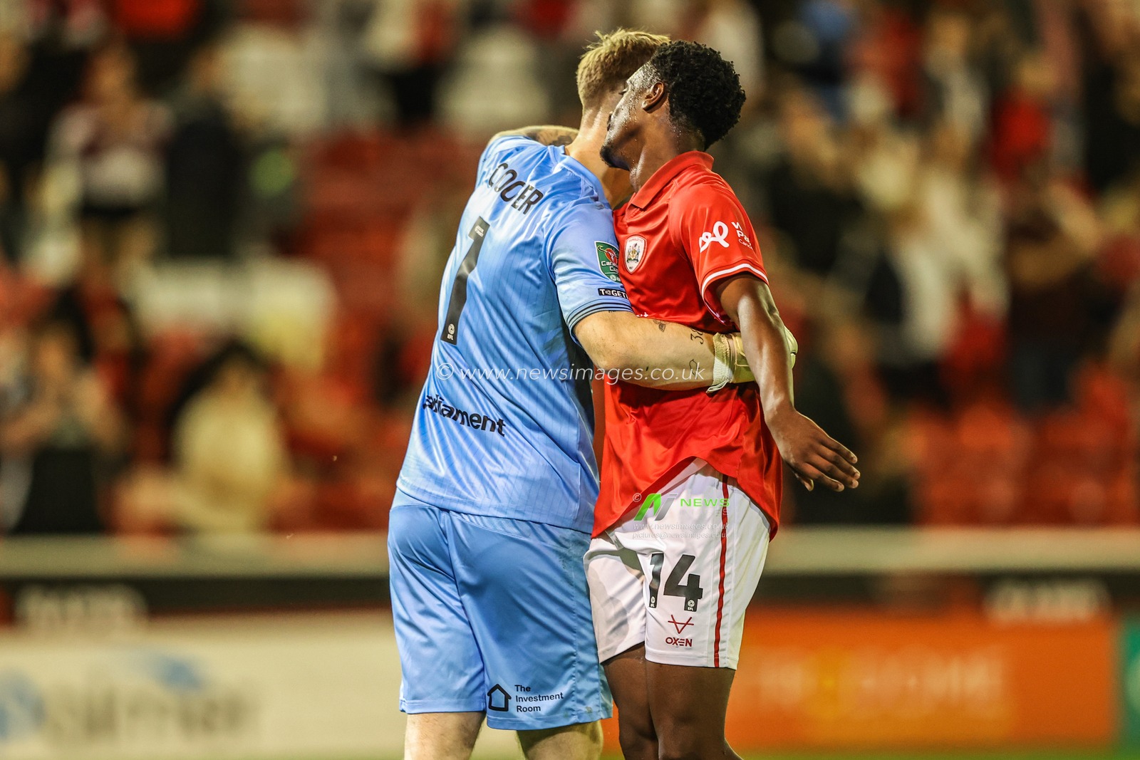 Murphy Cooper of Barnsley embraces Nathanael Ogbeta of Barnsley at the end of the game during the Carabao Cup match Barnsley vs Rotherham United at Oakwell, Barnsley, United Kingdom, 26th August 2025

(Photo by Alfie Cosgrove/News Images)