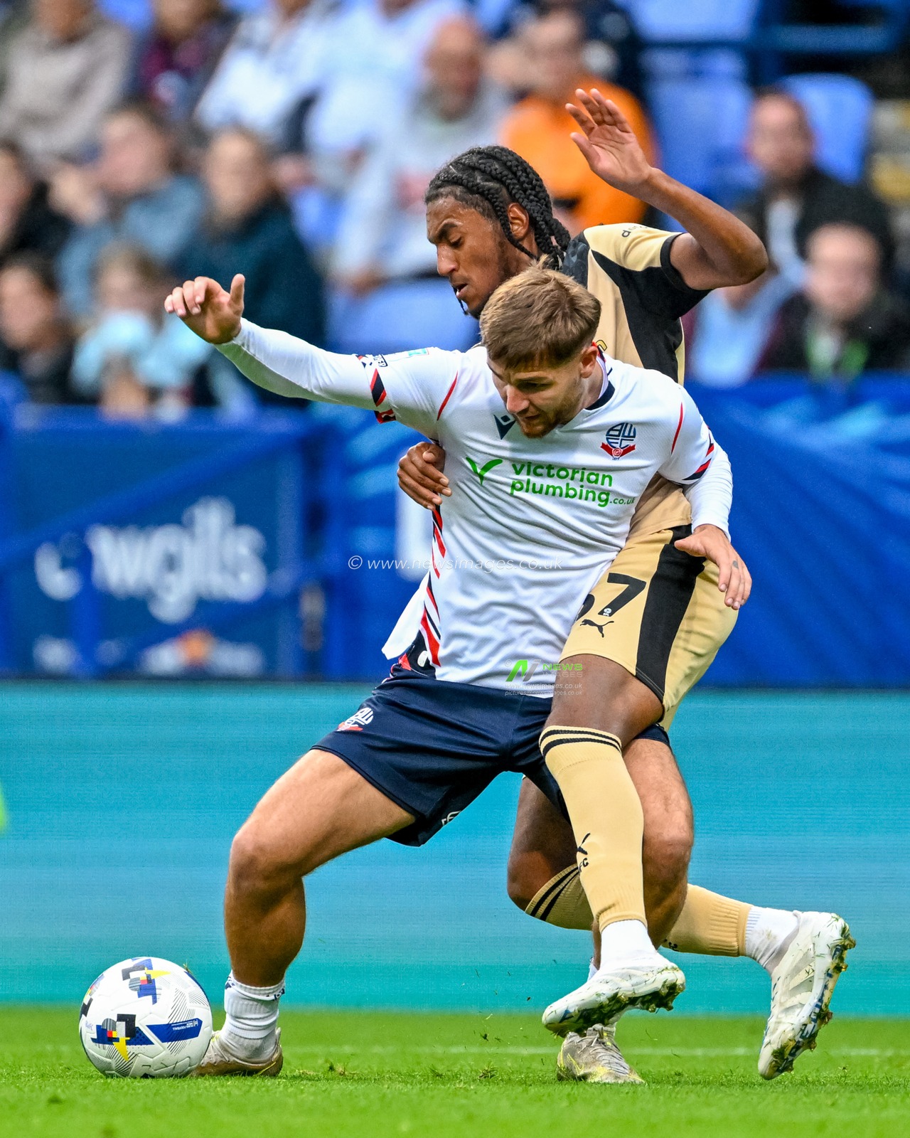 Sam Dolby of Bolton Wanderers  holds off James Clarke of Rotherham United during the The Vertu Trophy match Bolton Wanderers vs Rotherham United at Toughsheet Community Stadium, Bolton, United Kingdom, 2nd September 2025

(Photo by Adam Gee/News Images)