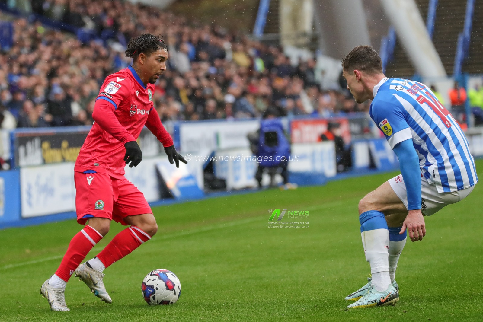 Tyrhys Dolan #10 of Blackburn Rovers holds the ball as Josh Ruffels #14 of Huddersfield Town pressures during the Sky Bet Championship match Huddersfield Town vs Blackburn Rovers at John Smith's Stadium, Huddersfield, United Kingdom, 10th April 2023

(Photo by Alfie Cosgrove/News Images)
