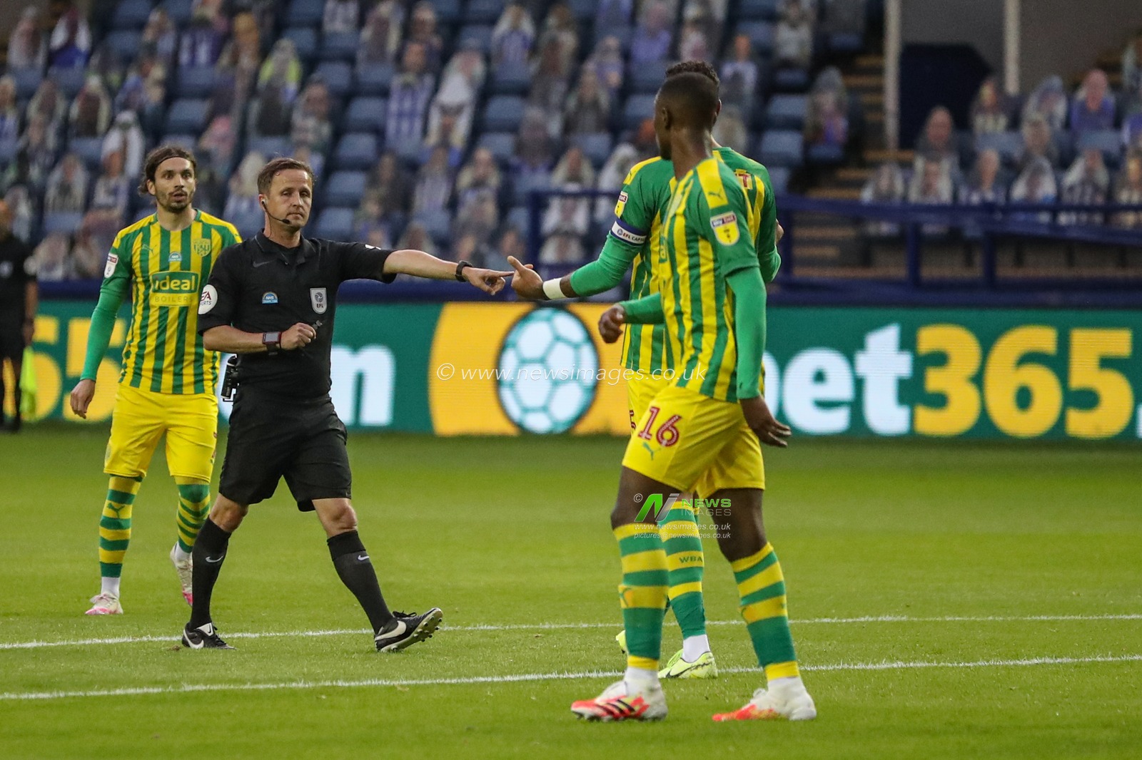 referee David Webb points to the spot as he gives West Brom a penalty