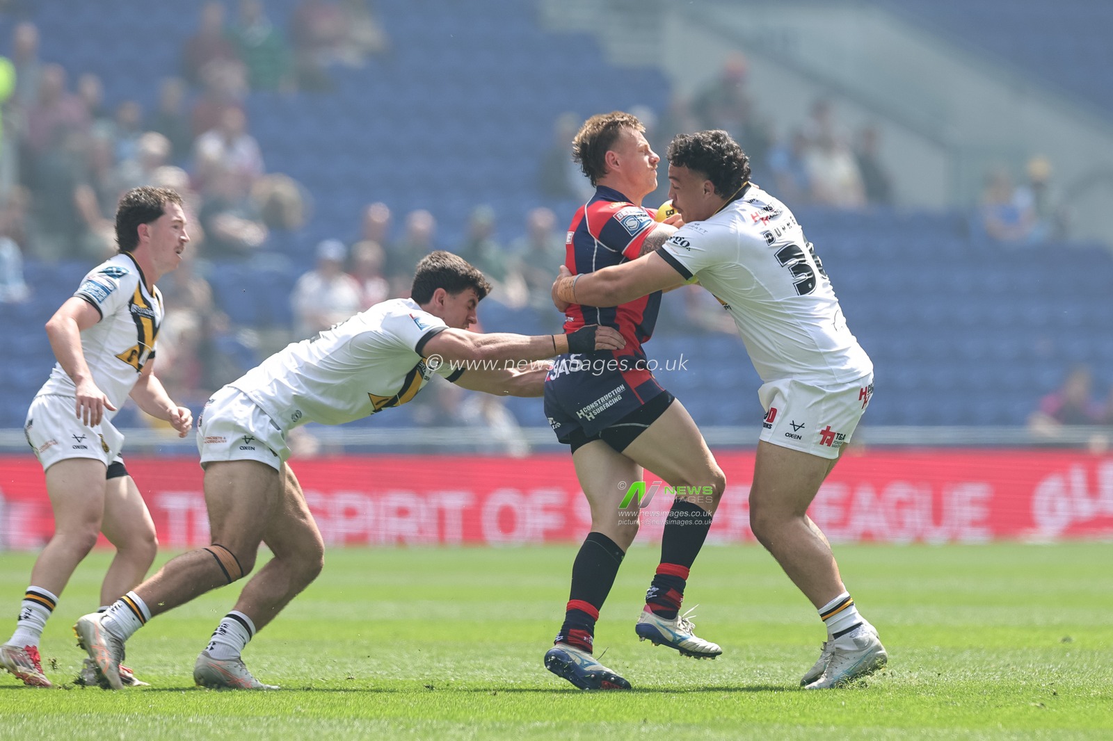 Tom Johnstone of Wakefield Trinity is tackled by Tyler Dupree of Castleford Tigers during the Betfred Super League Magic Weekend match Wakefield Trinity vs Castleford Tigers at Hill Dickinson Stadium, Liverpool, United Kingdom on 05 July 2026

(Photo by Mark Cosgrove/News Images)