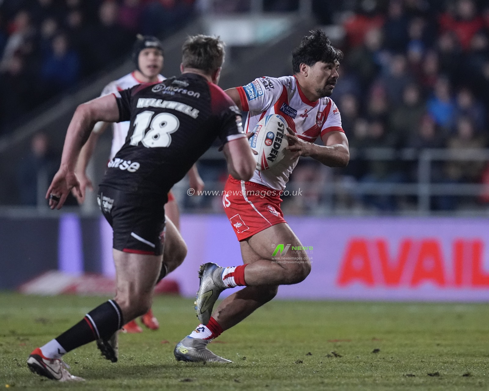 James Bell of St. Helens runs with the ball during the Betfred Super League Round 4 match St Helens vs Salford Red Devils at Totally Wicked Stadium, St Helens, United Kingdom, 8th March 2024

(Photo by Steve Flynn/News Images)