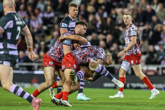 Tanguy Zenon of Huddersfield Giants is tackled by Louis Brogan of Leigh Leopards during the Betfred Super League round 9 match Leigh Leopards vs Huddersfield Giants at Leigh Sports Village, Leigh, United Kingdom on 23 April 2026

(Photo by Alfie Cosgrove/News Images)