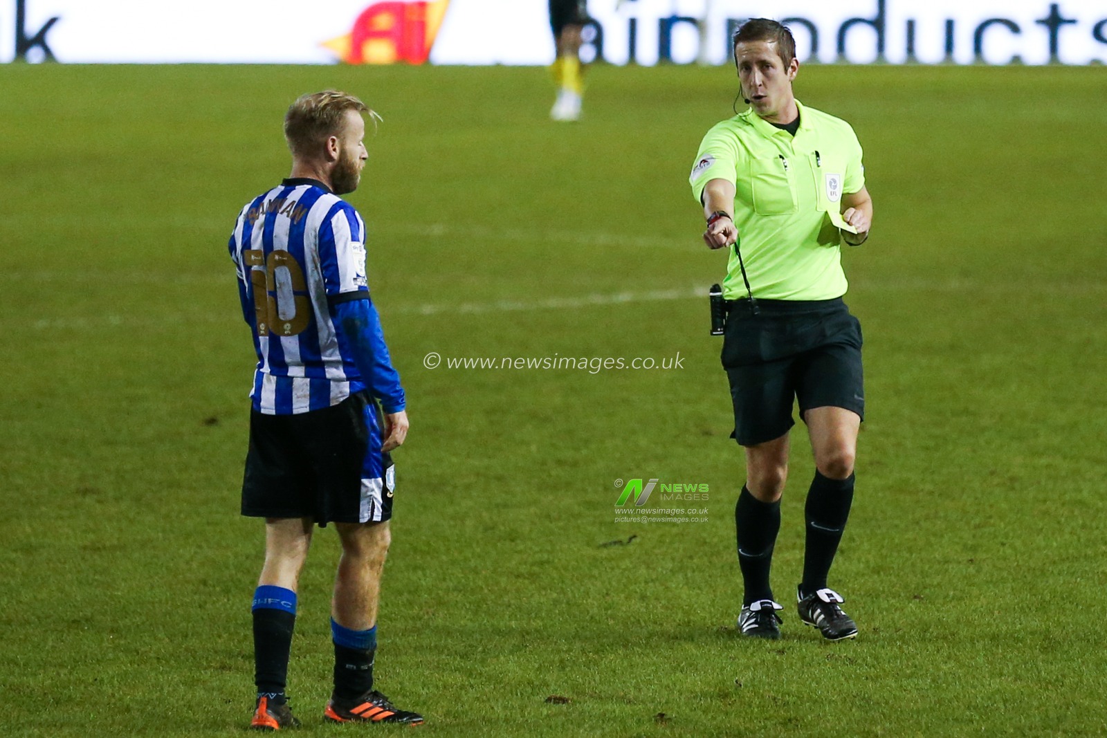 Barry Bannan #10 of Sheffield Wednesday talks with referee John Brooks