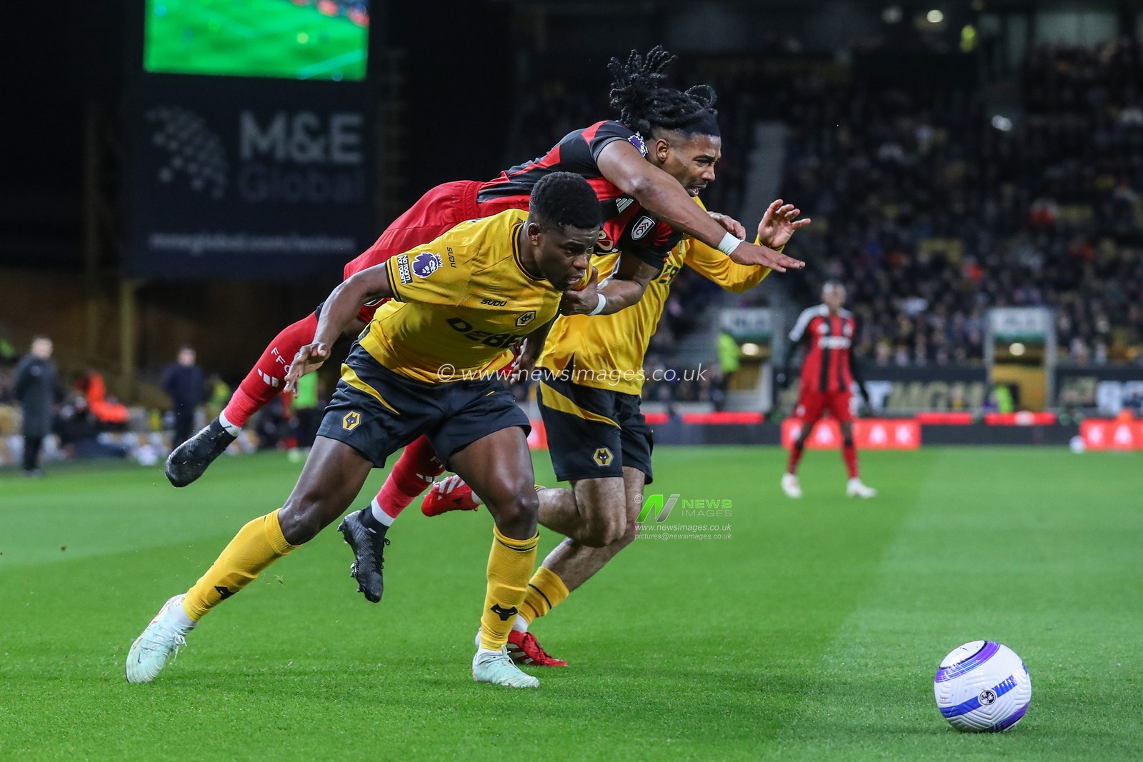 Adama TraorÃ© of Fulham and Marshall Munetsi of Wolverhampton Wanderers collide during the Premier League match Wolverhampton Wanderers vs Fulham at Molineux, Wolverhampton, United Kingdom, 25th February 2025

(Photo by Gareth Evans/News Images)