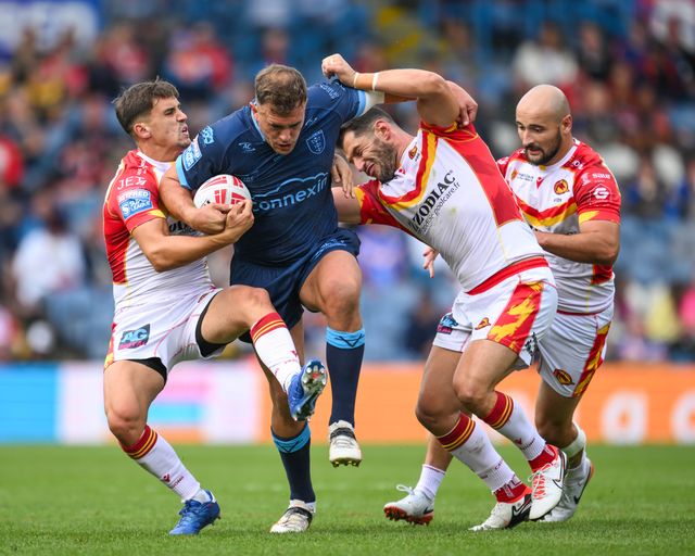 Jai Whitbread of Hull KR is tackled by Arthur Mourgue of Catalan Dragons and Ben Garcia of Catalan Dragons during the Magic Weekend match Catalans Dragons vs Hull KR at Elland Road, Leeds, United Kingdom, 18th August 2024

(Photo by Craig Thomas/News Images)