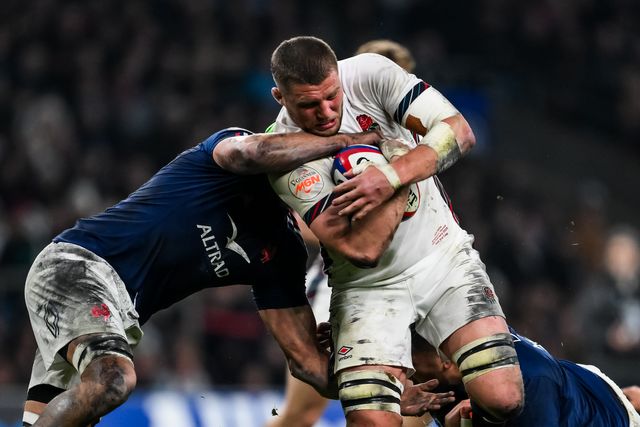 Tom Willis of England is tackled by FranÃ§ois Cros of France and Jean-Baptiste Gros of France during the 2025 Guinness 6 Nations match England vs France at Allianz Stadium,, Twickenham, United Kingdom, 8th February 2025

(Photo by Craig Thomas/News Images)