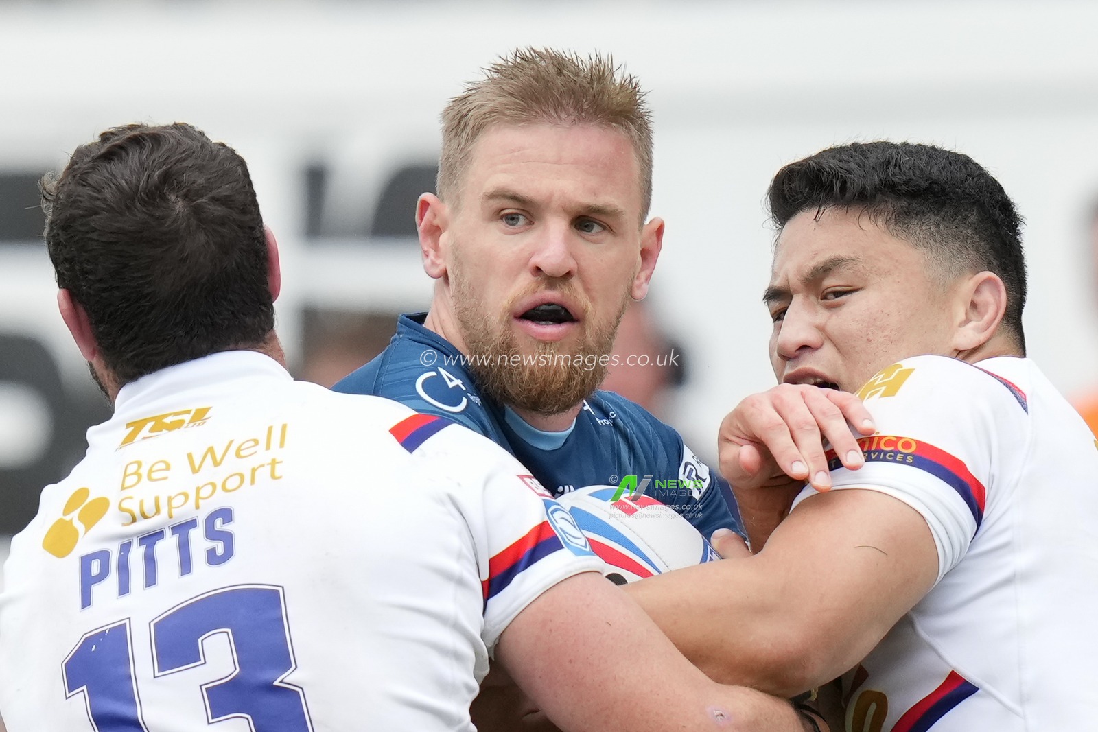 Jay Pitts #13 of Wakefield Trinity and Mason Lino #7 of Wakefield Trinity tackle Matt Dufty #1 of Warrington Wolves during the Betfred Super League Round 20 match Wakefield Trinity vs Warrington Wolves at The Be Well Support Stadium, Wakefield, United Kingdom, 30th July 2023

(Photo by Steve Flynn/News Images)