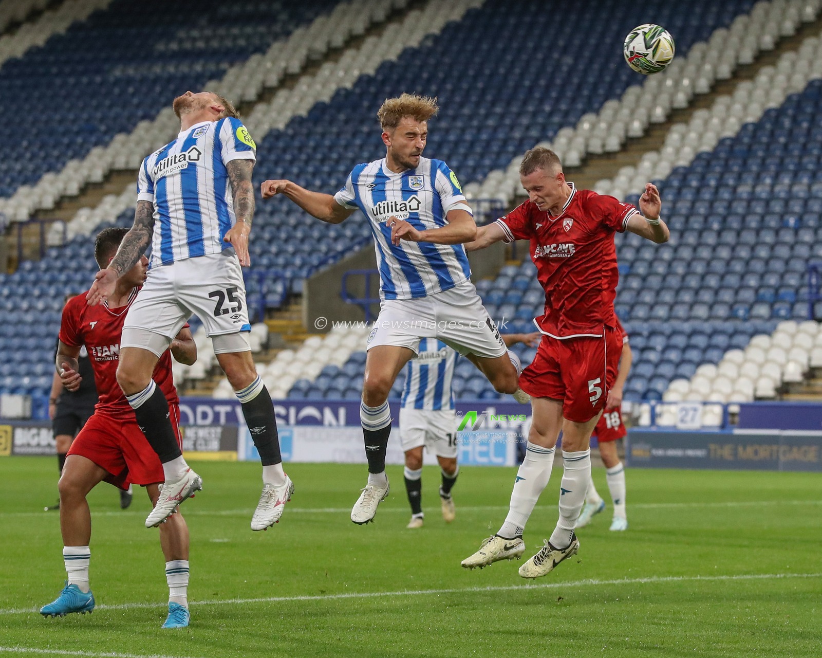 MichaÅ‚ Helik of Huddersfield Town heads the ball on goal but misses during the Carabao Cup match Huddersfield Town vs Morecambe at John Smith's Stadium, Huddersfield, United Kingdom, 13th August 2024

(Photo by Alfie Cosgrove/News Images)
