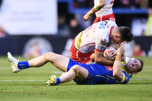 Matt Dufty of Warrington Wolves is challenged by Jack Welsby of St. Helens during the Betfred Super League play-off Eliminator 2 Warrington Wolves v St Helens at Halliwell Jones Stadium, Warrington, United Kingdom, 28th September 2024

(Photo by Ben Roberts/News Images)