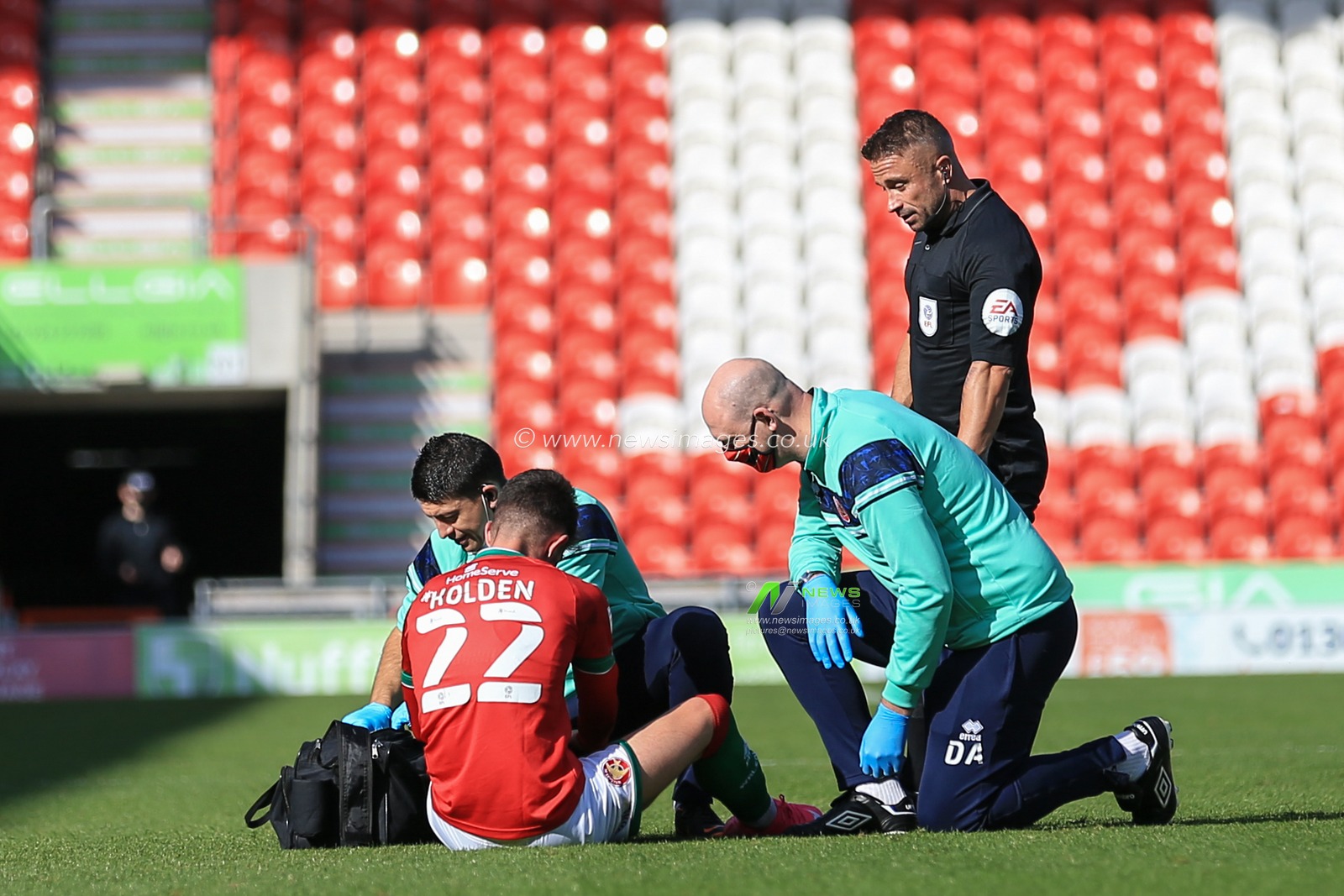 Rory Holden (22) of Walsall is injured