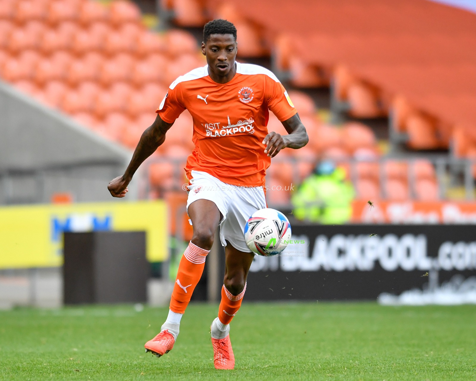 Marvin Ekpiteta (21) of Blackpool with the ball