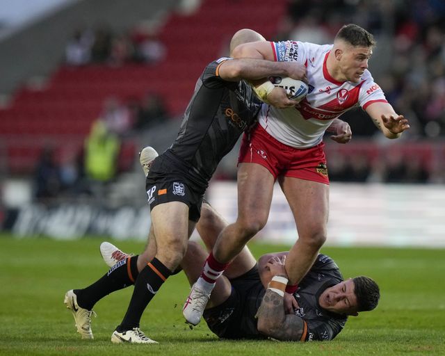 Morgan Knowles of St. Helens breaks a tackle by Danny Houghton of Hull FC during the Betfred Super League  Round 8 match St Helens vs Hull FC at Totally Wicked Stadium, St Helens, United Kingdom, 19th April 2024

(Photo by Steve Flynn/News Images)