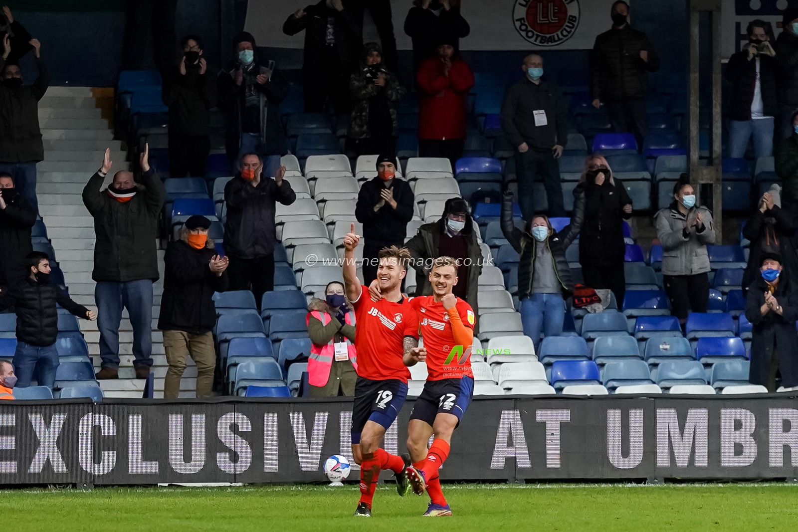 James Collins #19 of Luton Town celebrates with Kiernan DewsburyHall #22 of Luton Town after scoring.