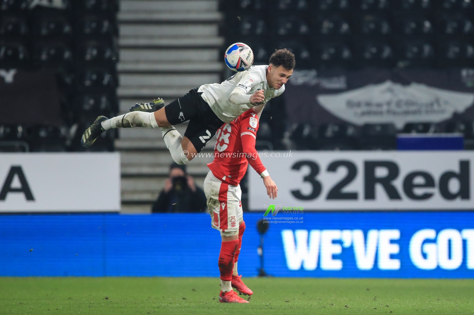 Lee Buchanan #26 of Derby County and Anthony Knockaert #28 of Nottingham Forest dual for the ball