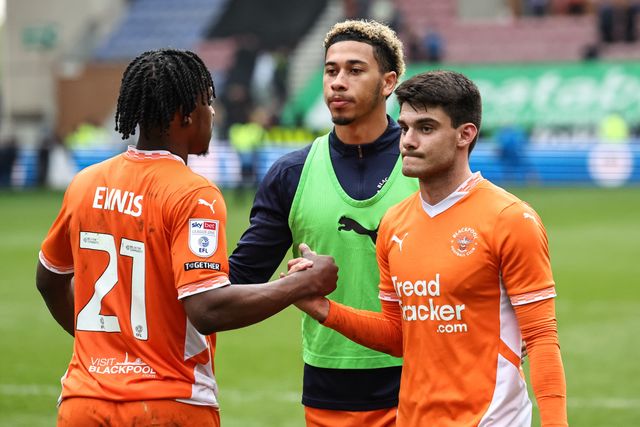 Niall Ennis of Blackpool shakes hands with Rob Apter of Blackpool during the Sky Bet League 1 match Wigan Athletic vs Blackpool at The Brick Community Stadium, Wigan, United Kingdom, 26th April 2025

(Photo by Mark Cosgrove/News Images)